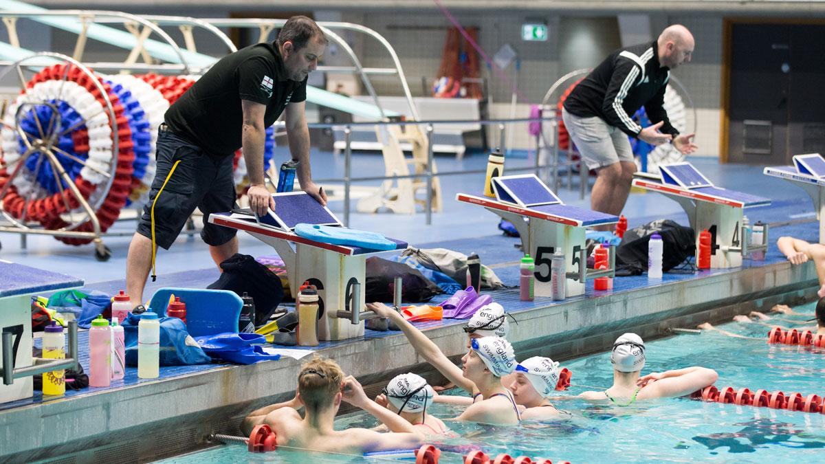 swimming_coaches_with_swimmers_in_water_2016
